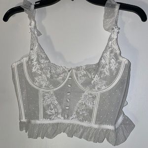 Super cute white corset top. Never worn. Adjustable in the back. Size XL